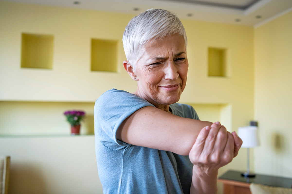 Chris Treat Tulsa Elbow and Shoulder Surgeon image on an older woman experience elbow or shoulder pain